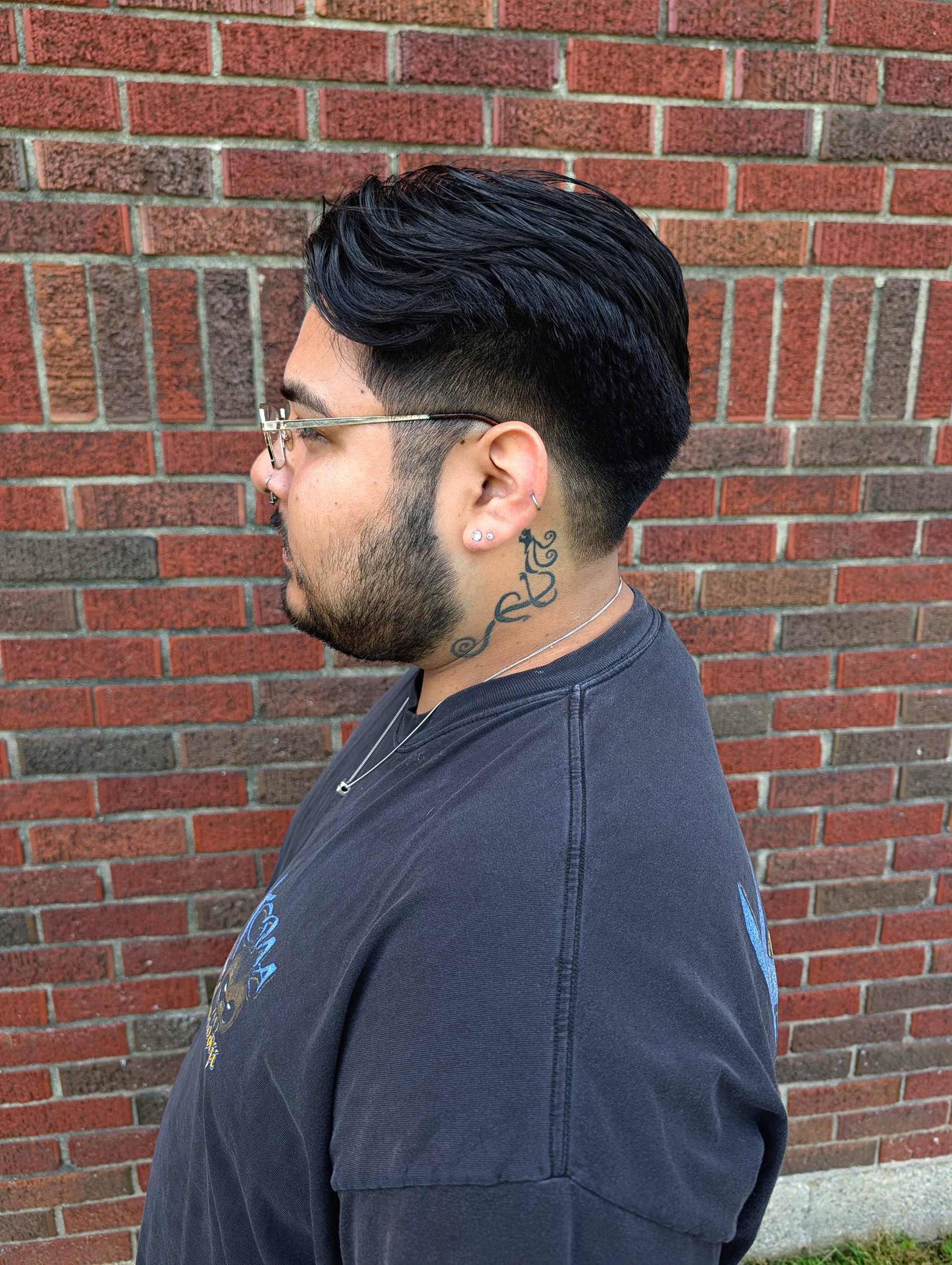 A sculpted black pompadour and fade, posted from SalonFawn.